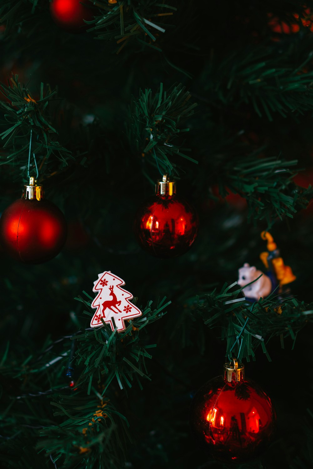 a close up of a christmas tree with ornaments