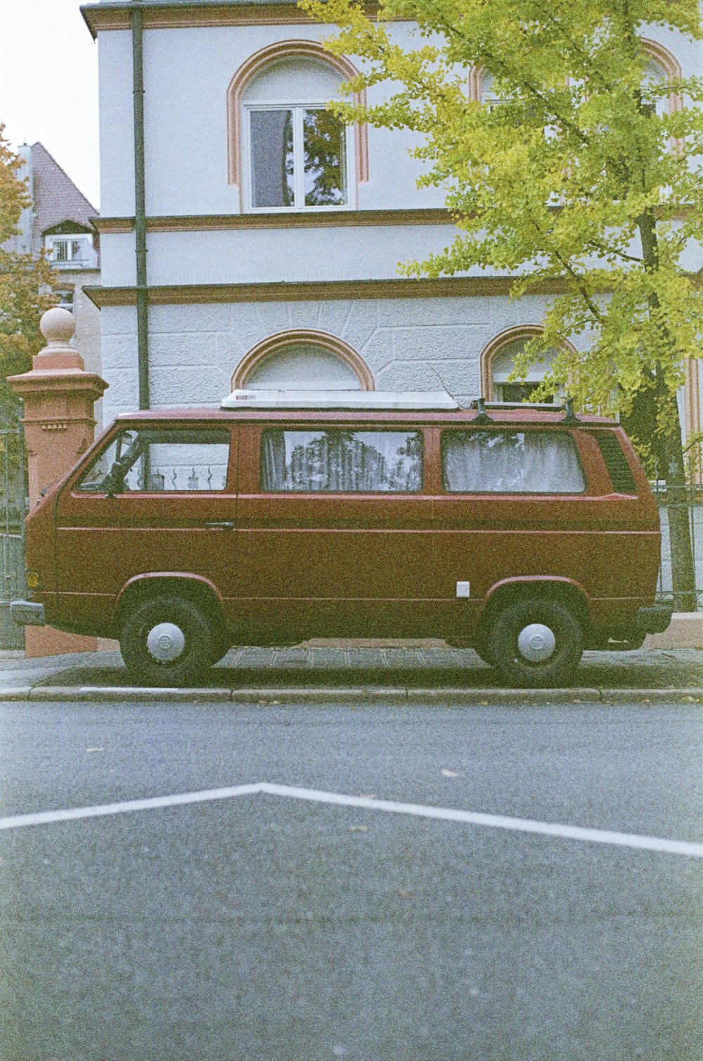 a van is parked in front of a house