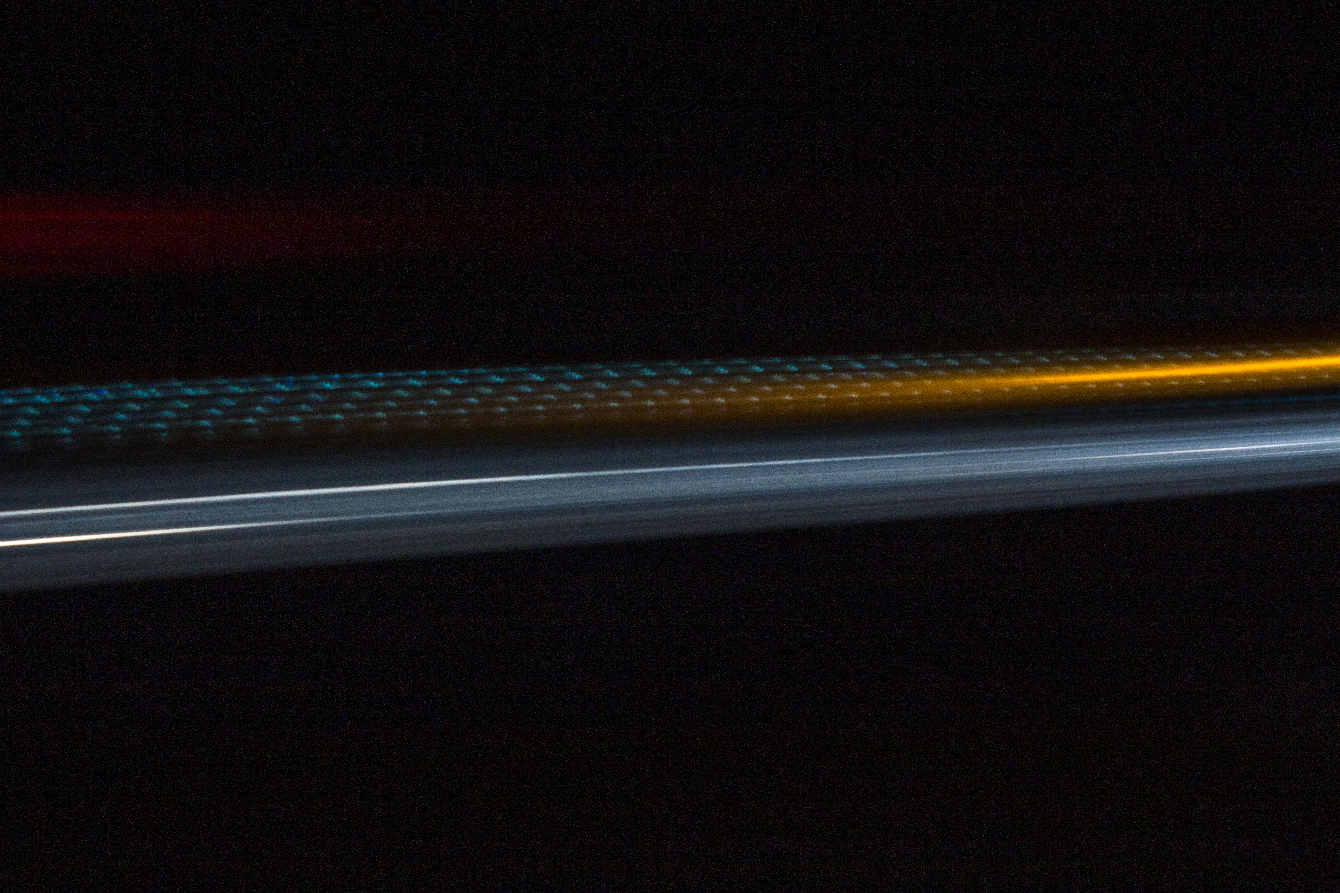 a blurry photo of a street light at night