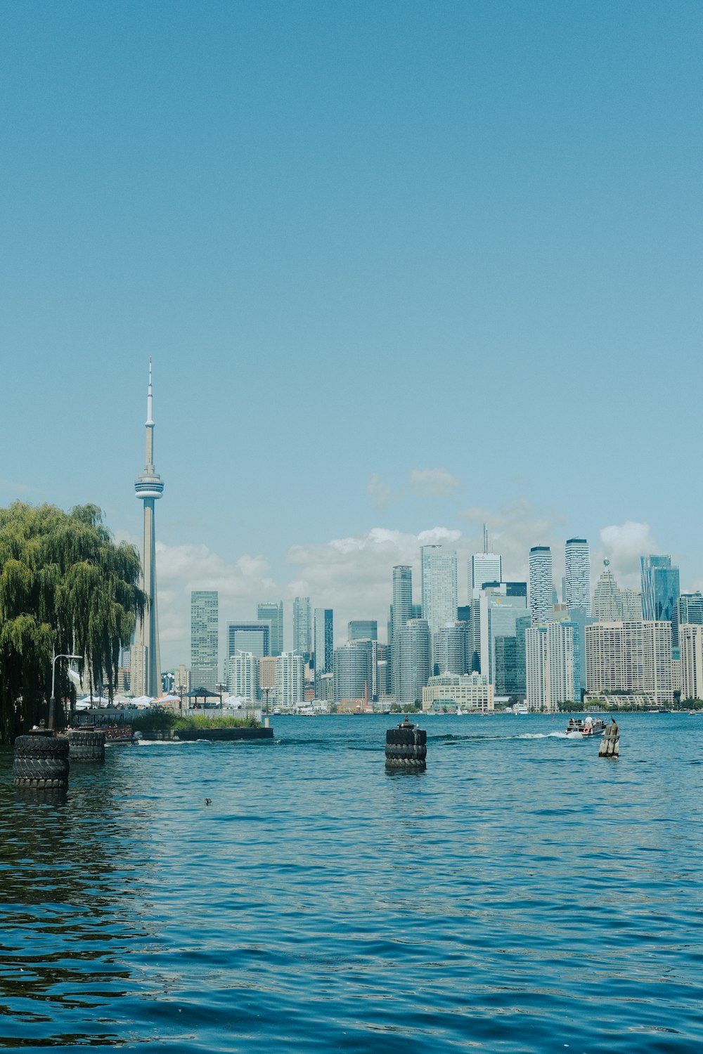 a large body of water with a city in the background