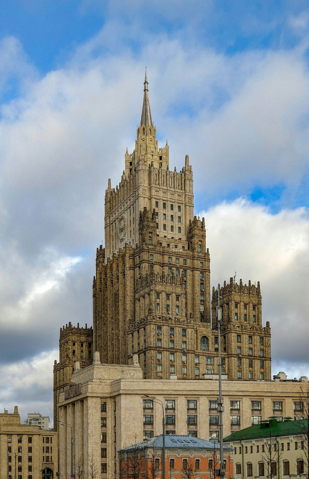 a very tall building with a clock on it's side