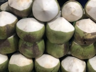 a pile of coconuts sitting on top of each other