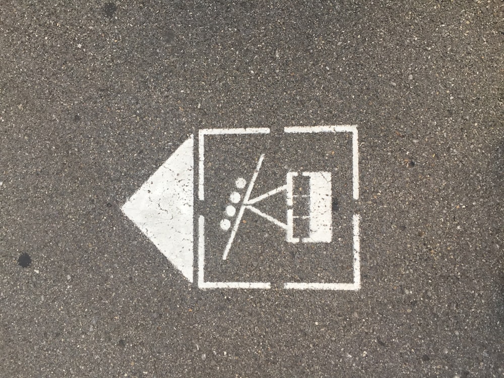 a white arrow pointing to a parking space