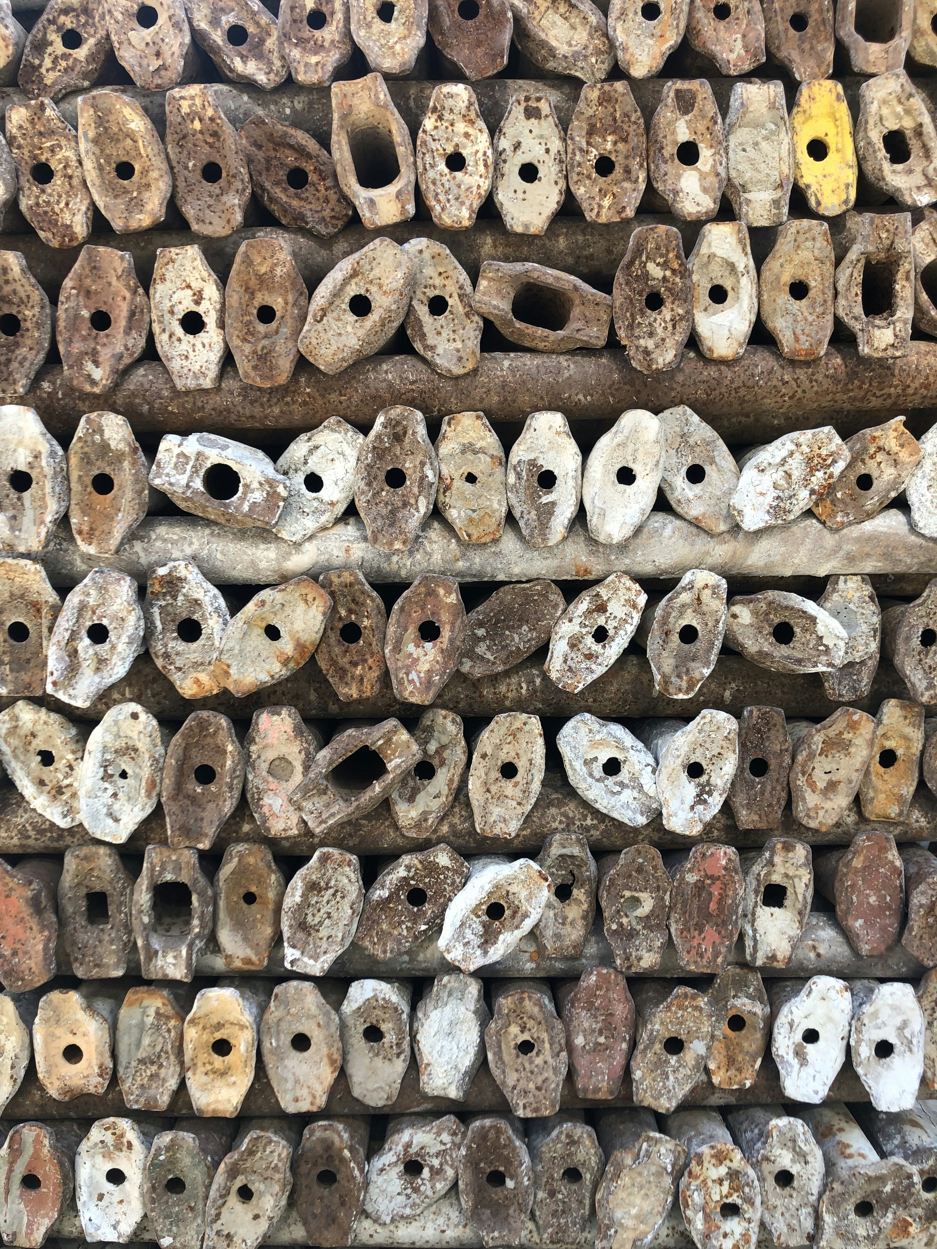 a large pile of old and rusty objects