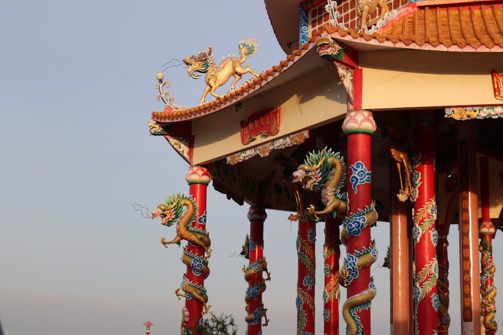 a building with a dragon decoration on the top of it