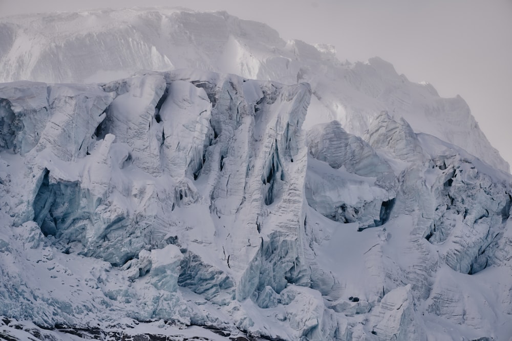 a large mountain covered in snow and ice