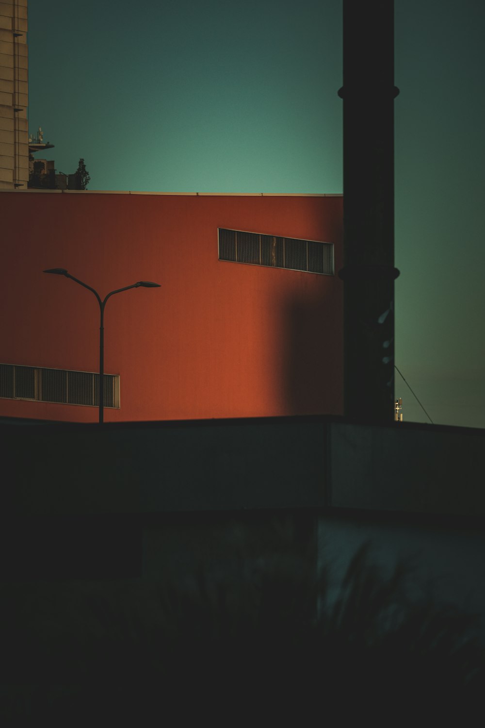 a red building with a street light in front of it