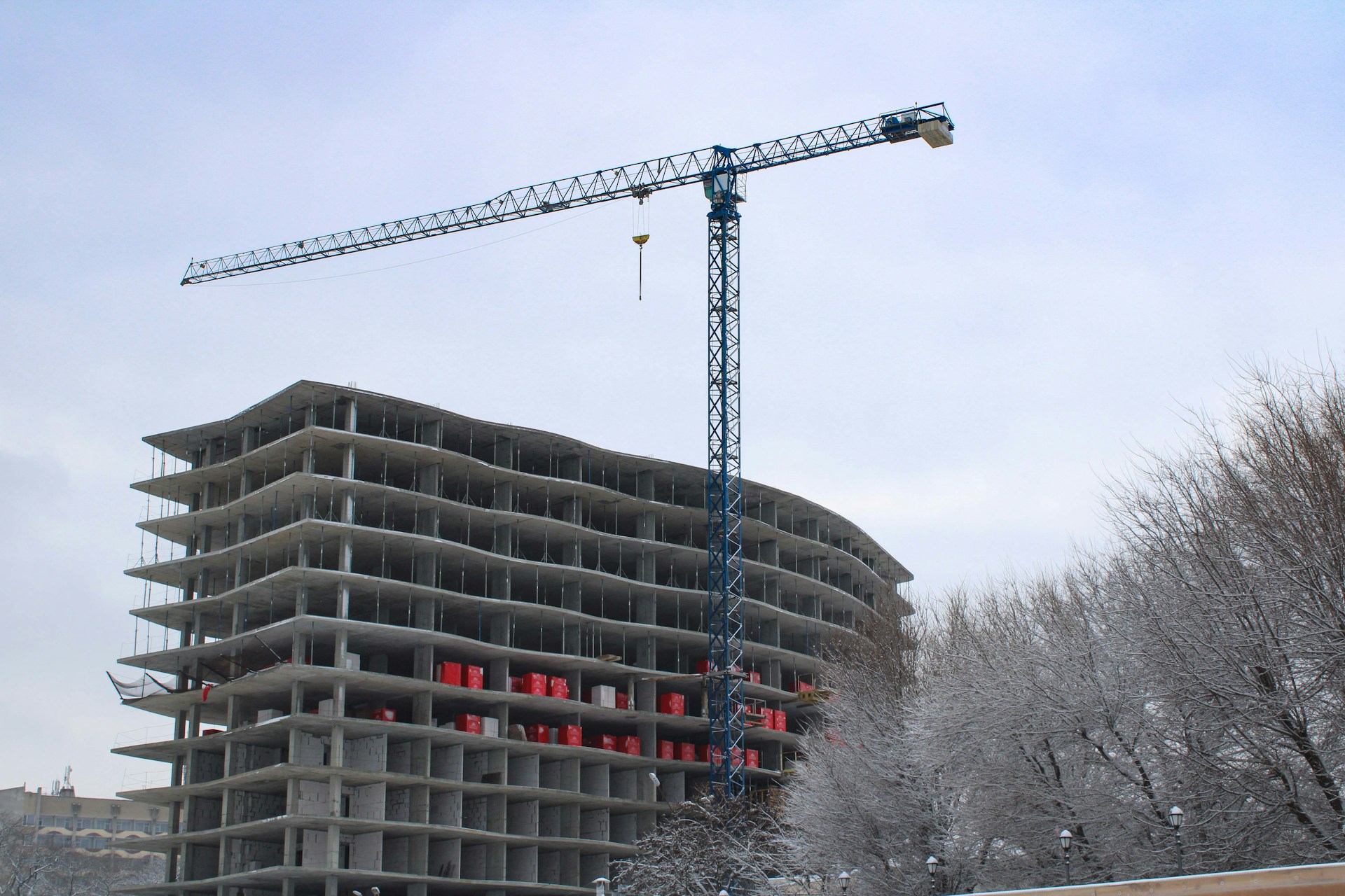 a crane is on top of a building under construction
