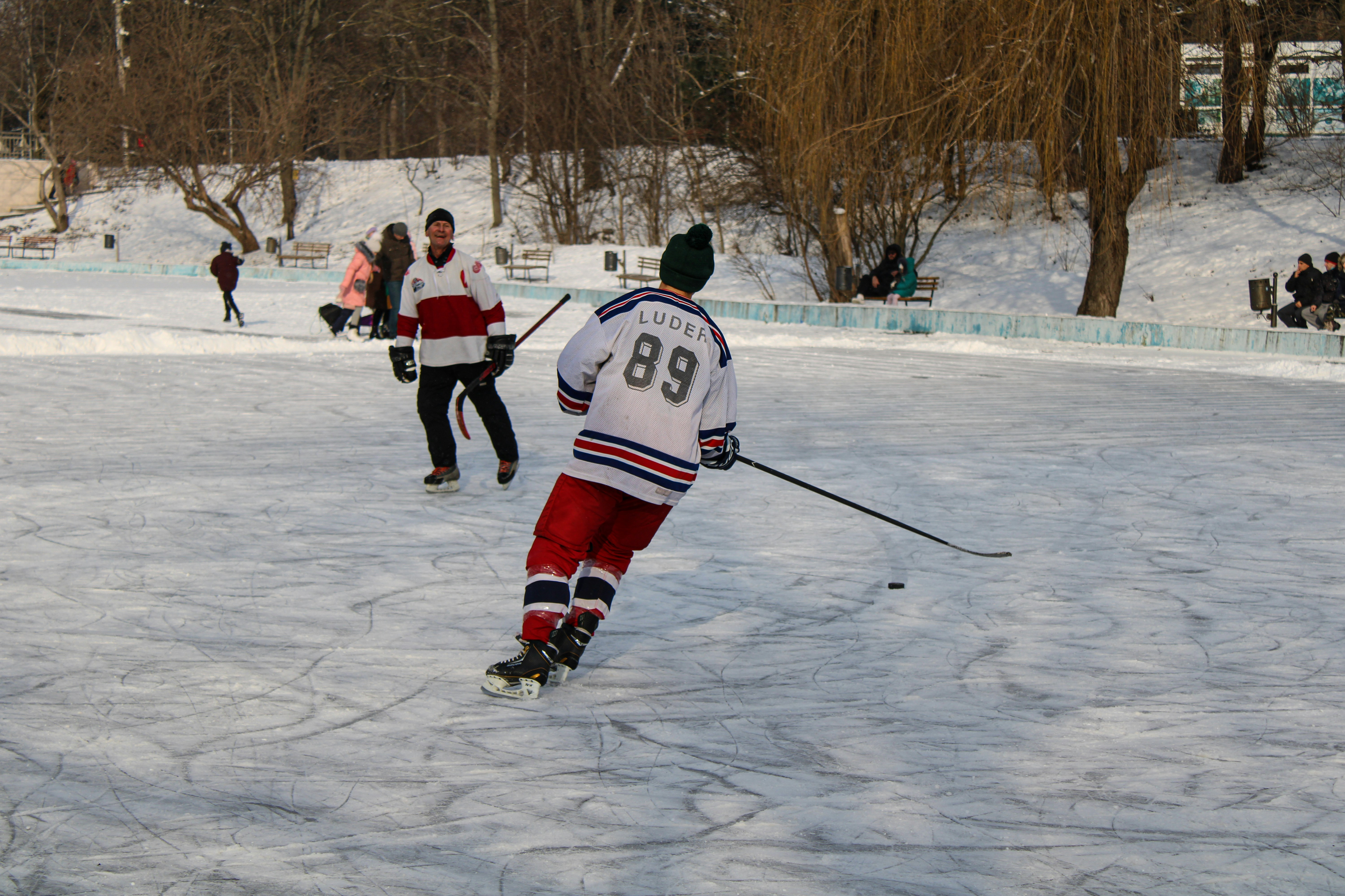 Men playing hockey game