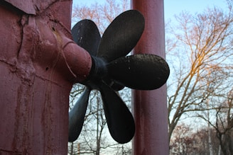 a close up of a metal object on a wall