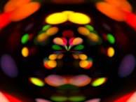 Abstract colorful sound waves visualized on a digital screen in a dark room.