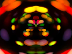 Abstract visuals projected behind Stevaan during a live performance, blending light and sound