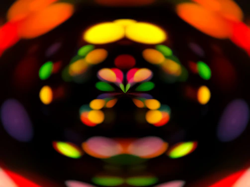 A mesmerizing drone light show illuminating the night sky in vibrant neon colors.