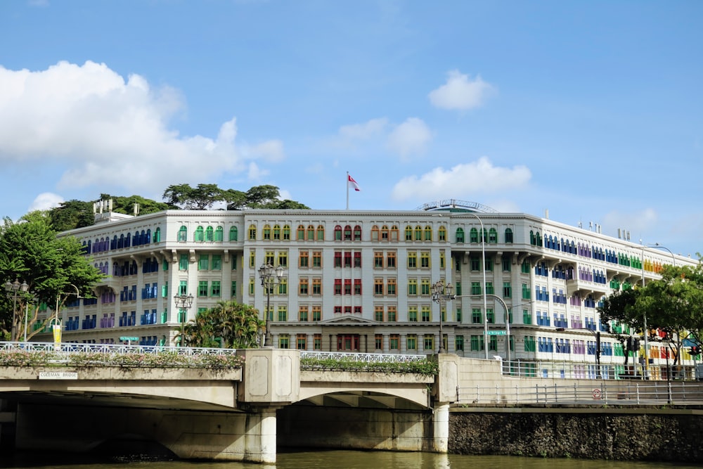 a large white building with colorful windows on the side of it