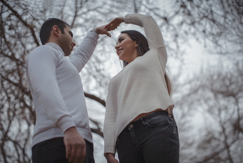 a man and a woman standing next to each other