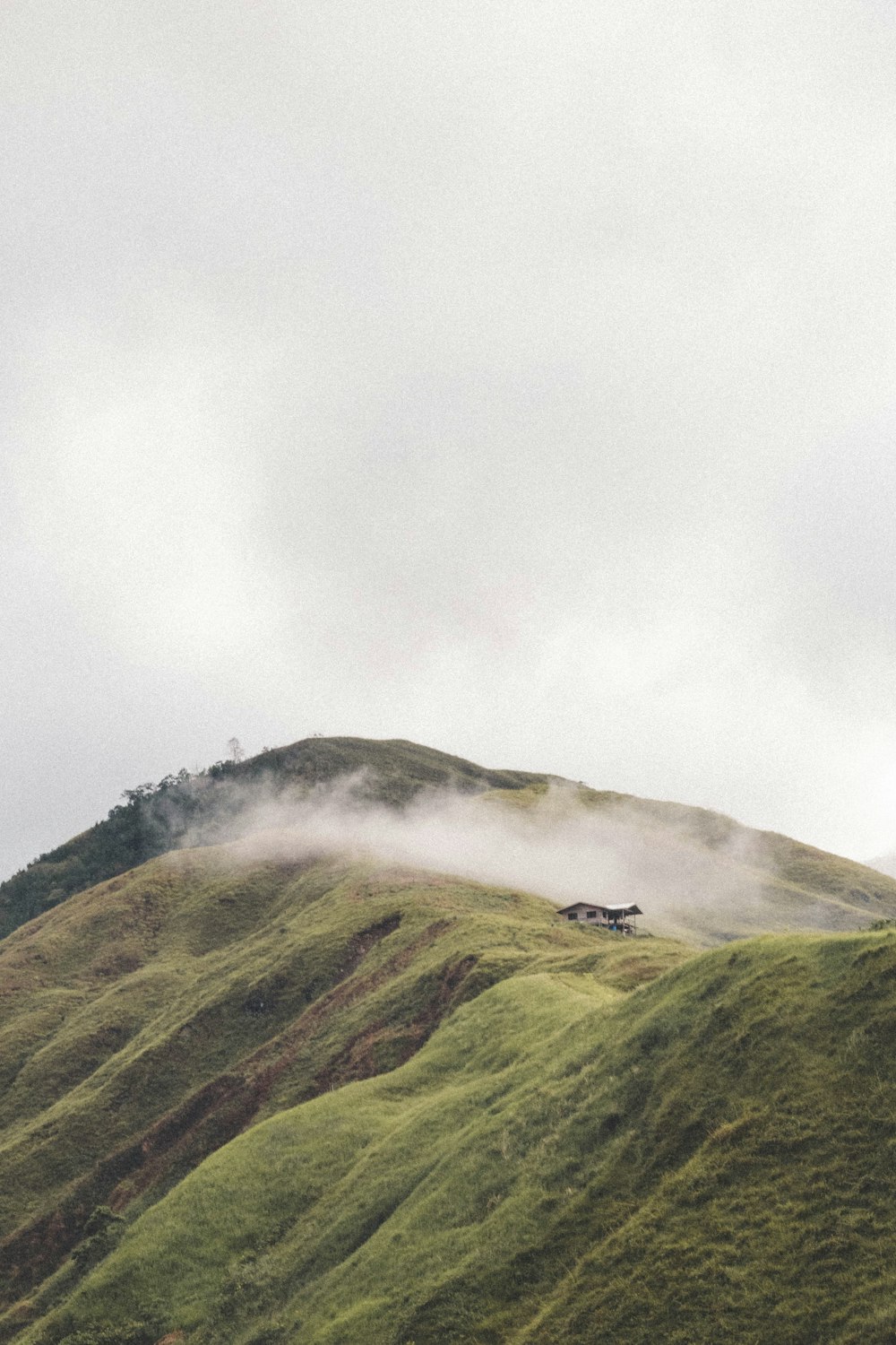 a hill with a house on top of it