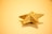 Sophisticated gold star rating shining softly against a clean, modern backdrop.