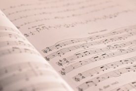 an open book with musical notes on it