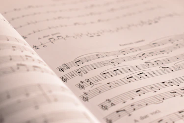 an open book with musical notes on it