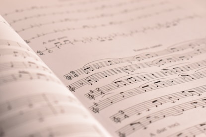 an open book with musical notes on it