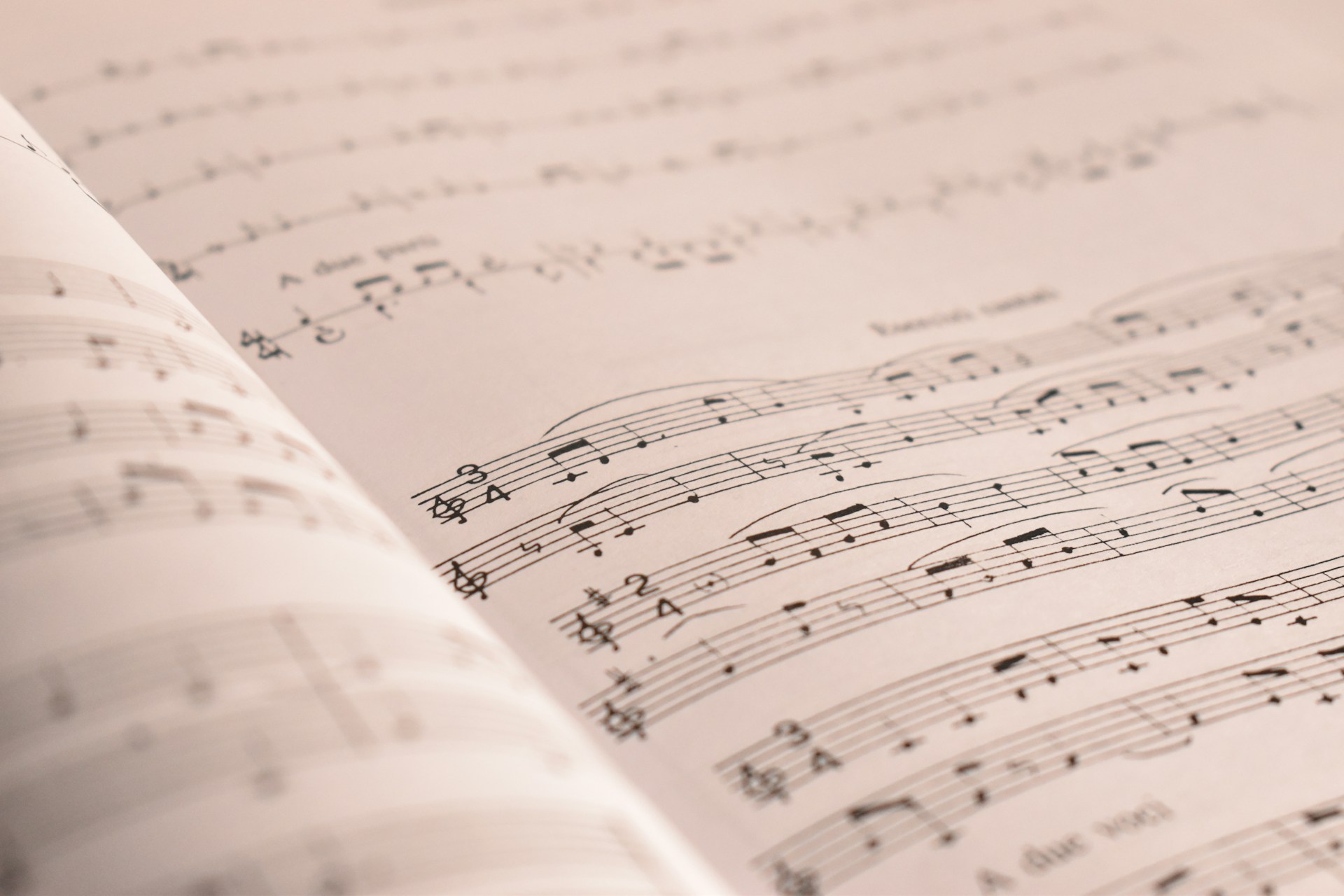 an open book with musical notes on it