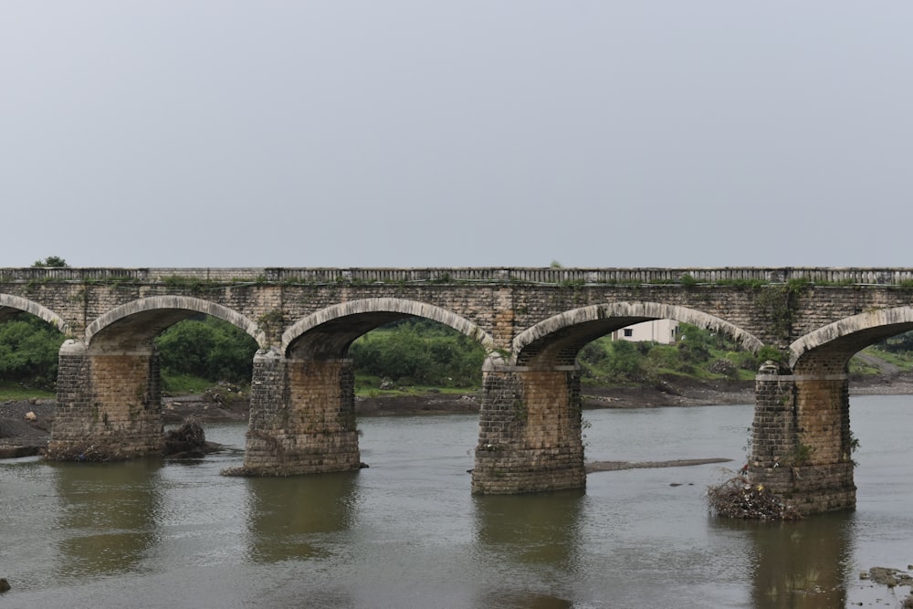 a bridge over a river with a train on it