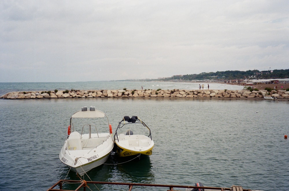 a couple of boats that are sitting in the water