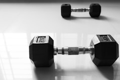 a pair of dumbs sitting on top of a table