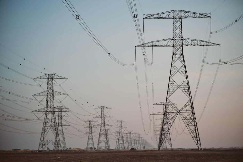 a large group of power lines in the middle of a field