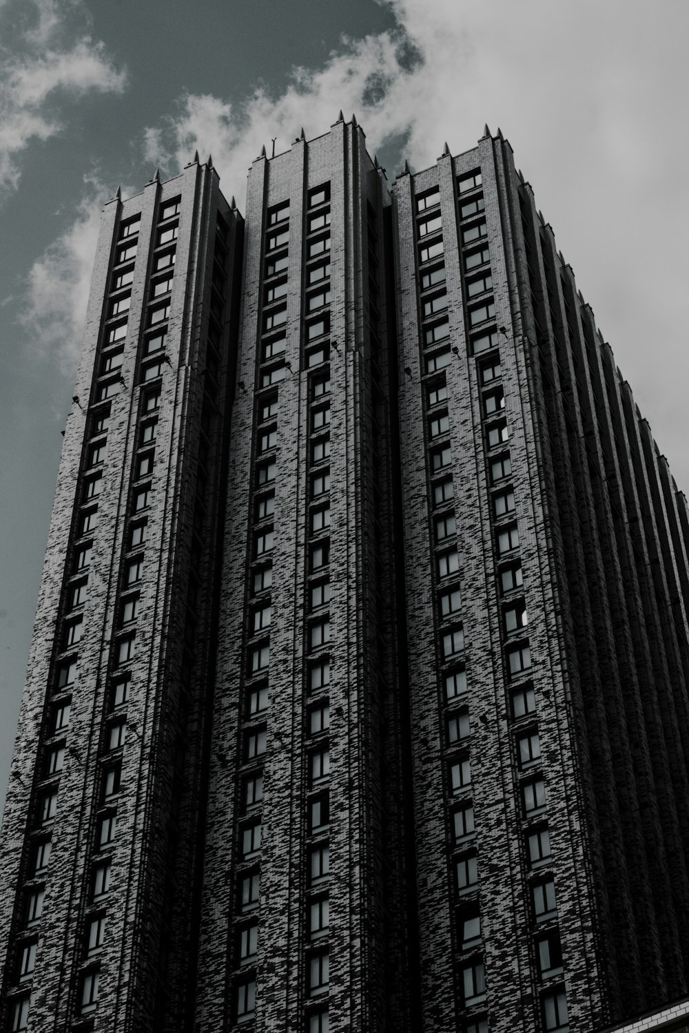 a black and white photo of a tall building