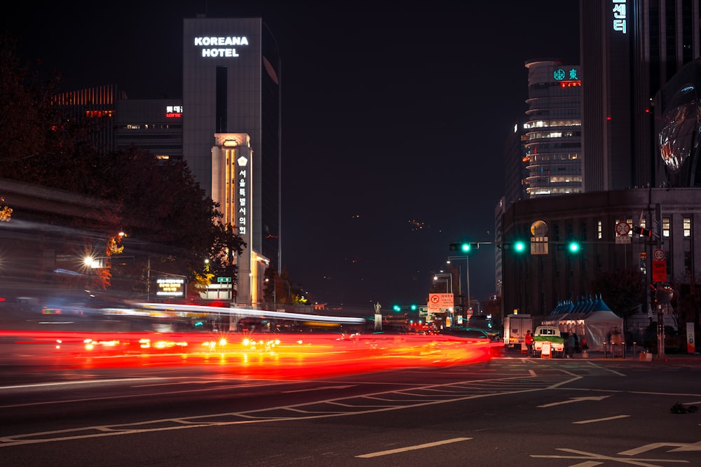 a city street at night with traffic lights