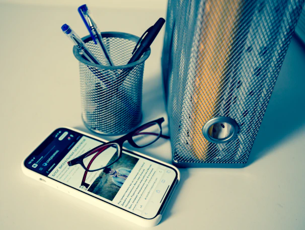 A sleek 3D printed desktop organizer holding pens and gadgets in a modern office setting.