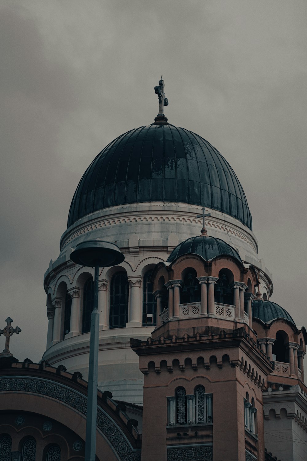 a large building with a cross on top of it