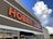 A large retail store with 'Hobby Lobby' prominently displayed in bold orange letters on the building facade. The design features a clean, modern look under a partly cloudy sky.