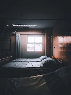 A cozy hospital room in India with soft pastel tones, prepared for a fertility treatment.