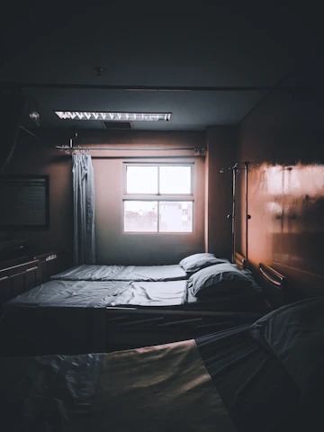 an elderly patient in a bright, clean hospital room.