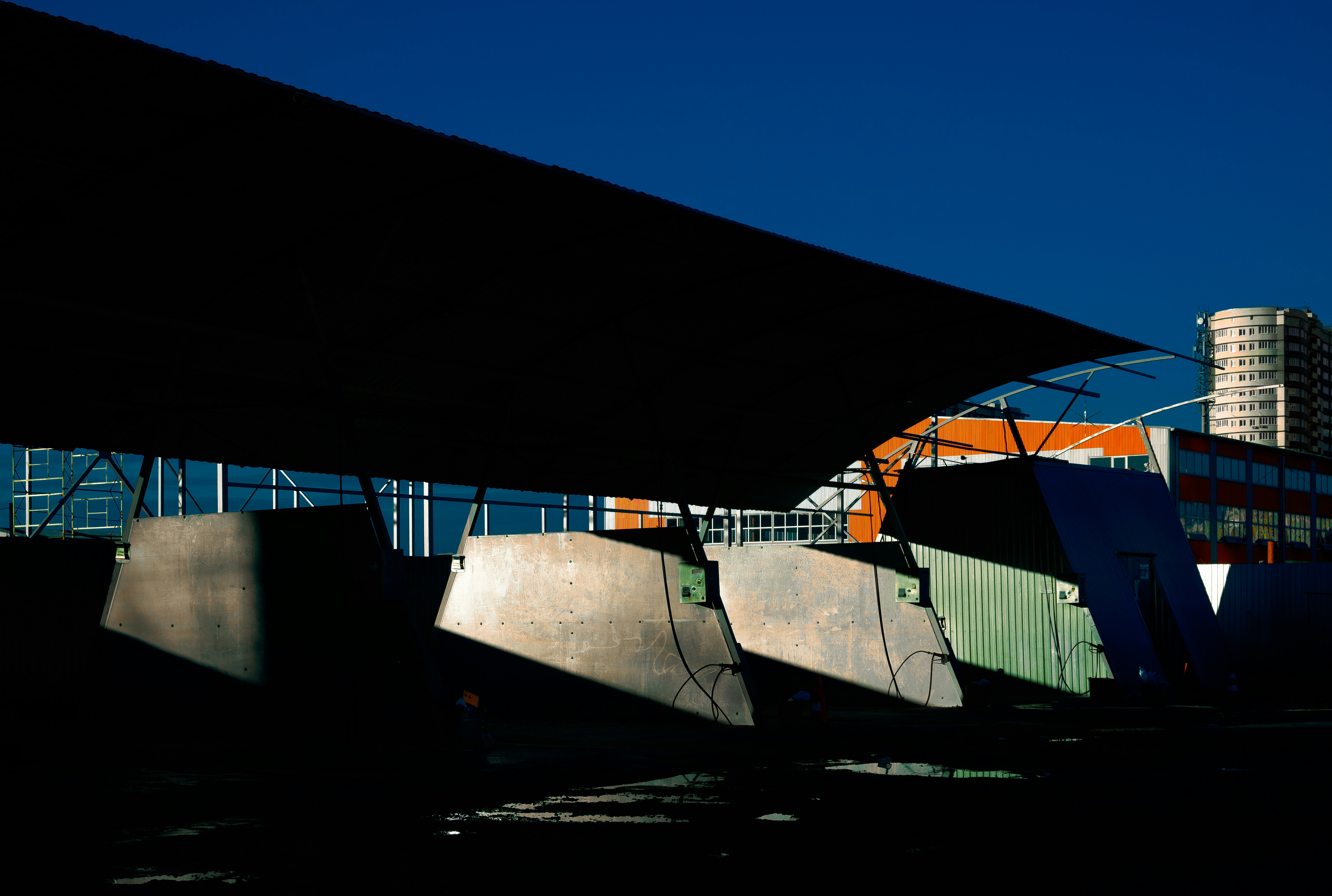 A group of skateboard ramps under a bridge photo – Free Building Image ...