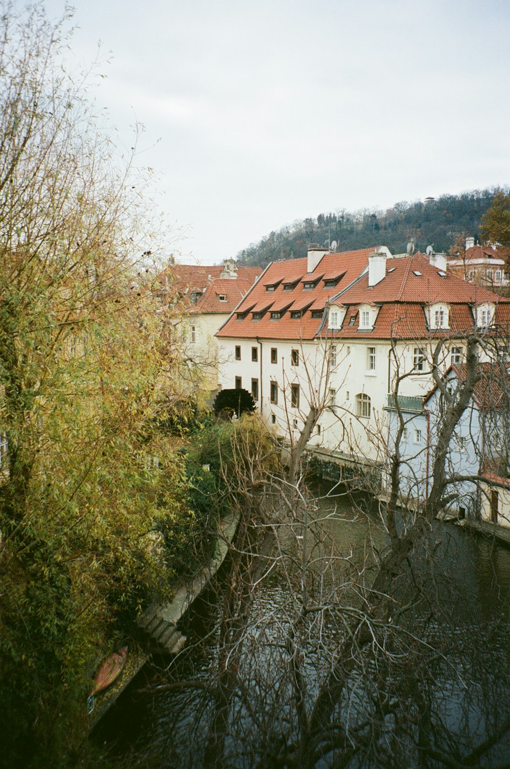 a river running through a city next to tall buildings