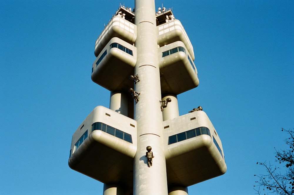 a tall building with multiple balconies on top of it