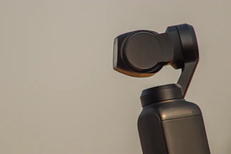Close-up of a gimbal motor mounted on a test board with wires connected.