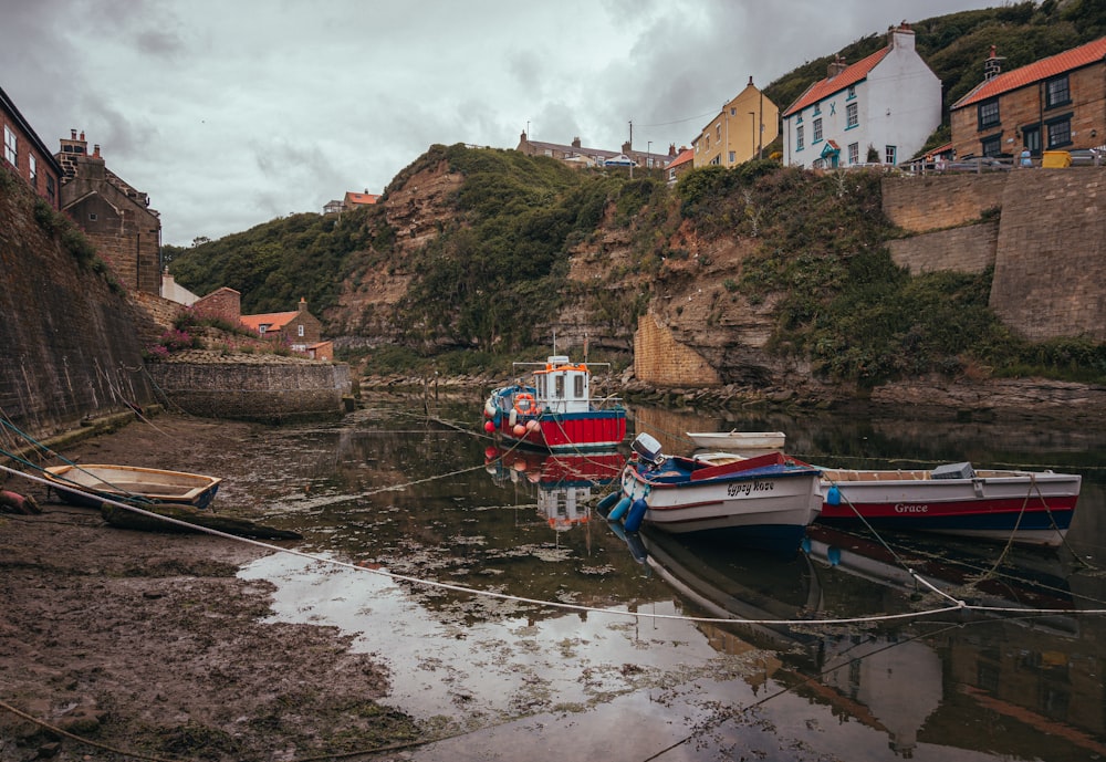 a group of boats that are sitting in the water