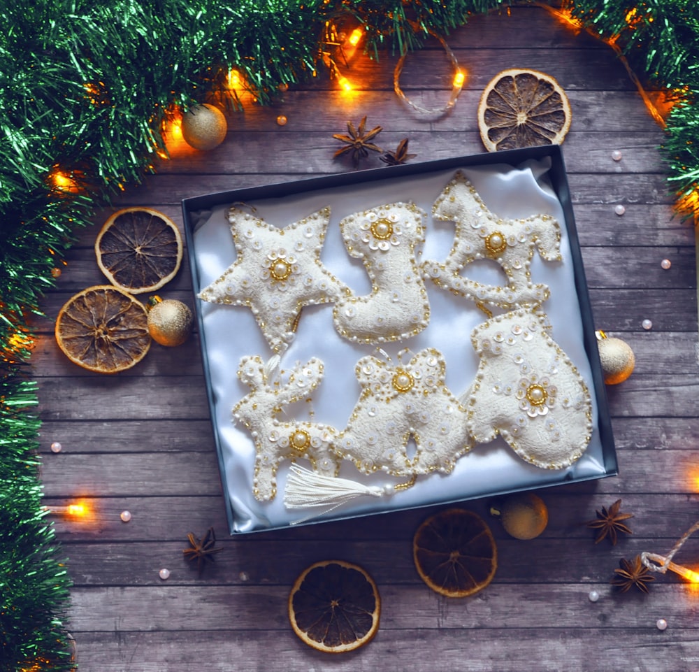 a tray of decorated cookies on a wooden table