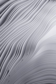 a black and white photo of a wavy surface