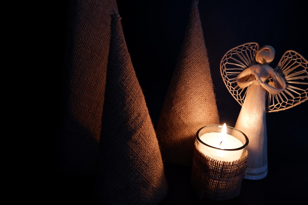 a couple of candles sitting next to each other