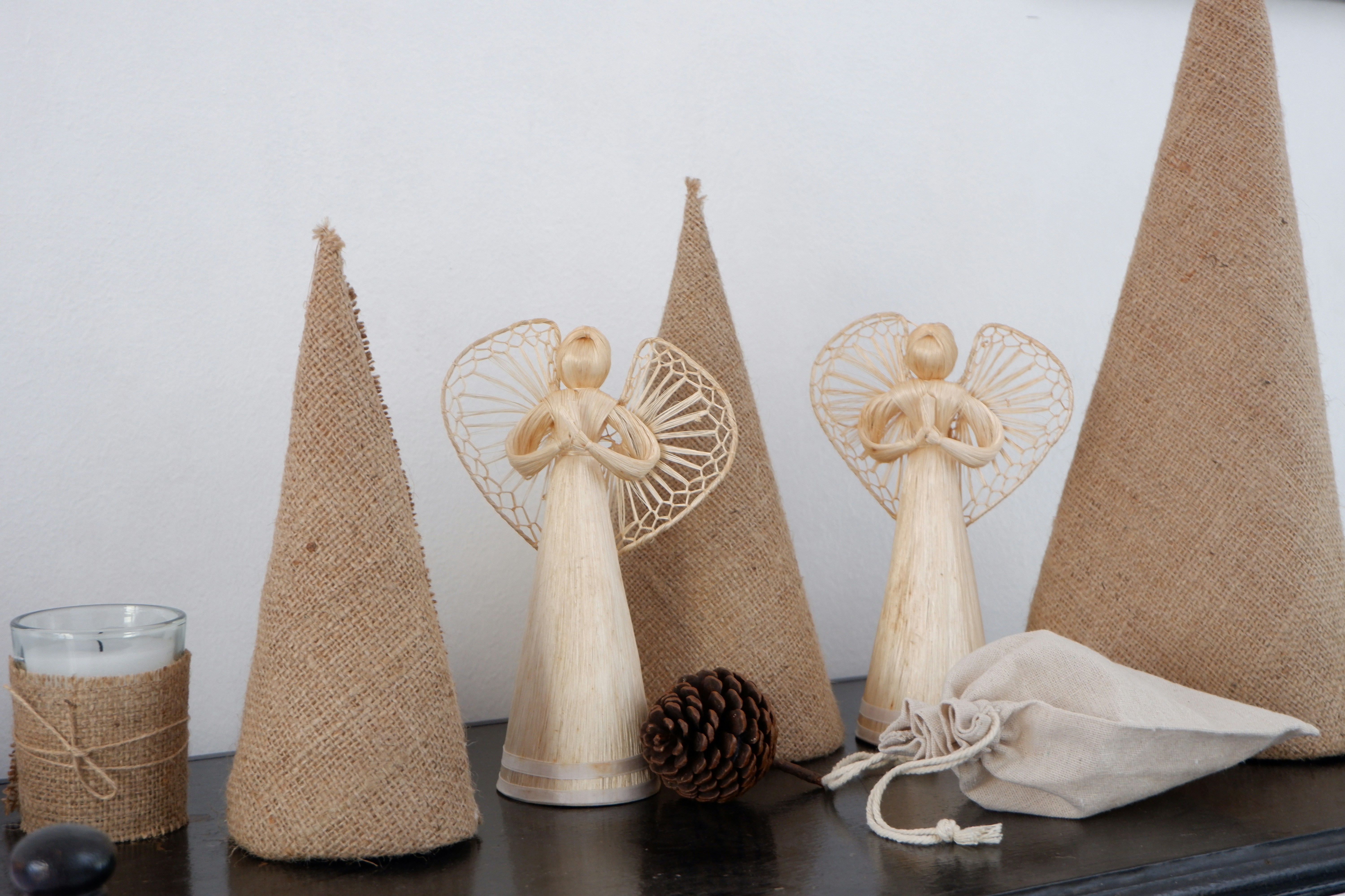 a group of three wooden cones sitting on top of a table