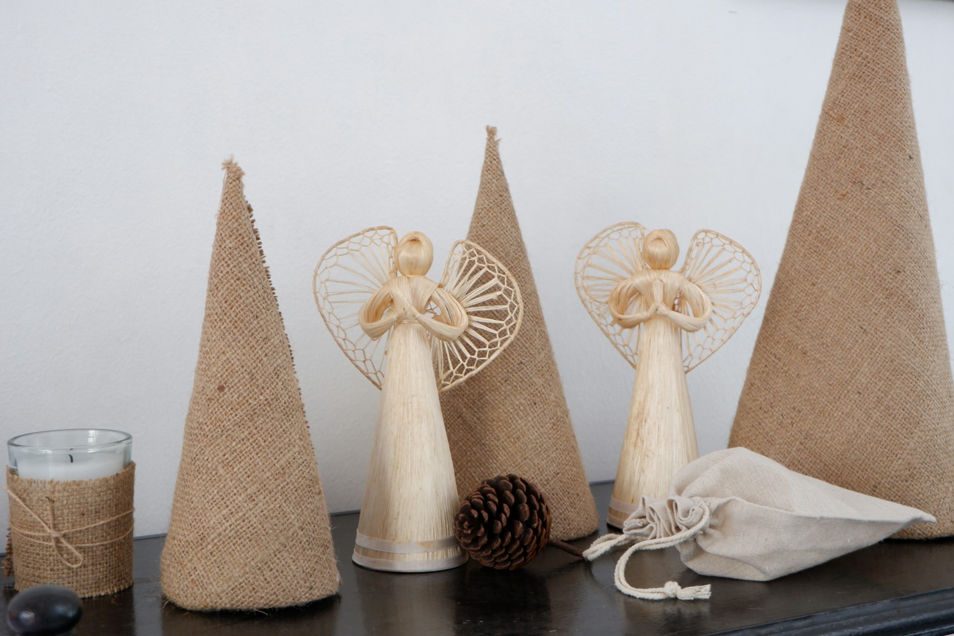 a group of three wooden cones sitting on top of a table