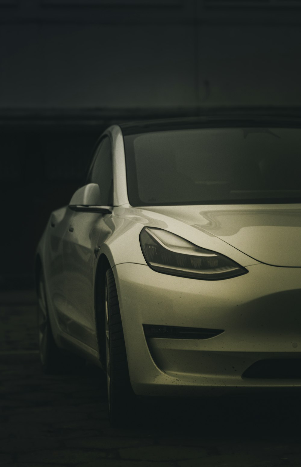 a white car parked in a parking garage