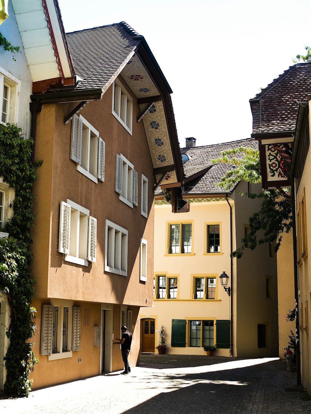 a person is walking down a narrow street