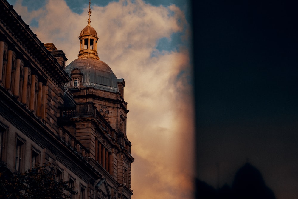 a tall building with a golden dome on top