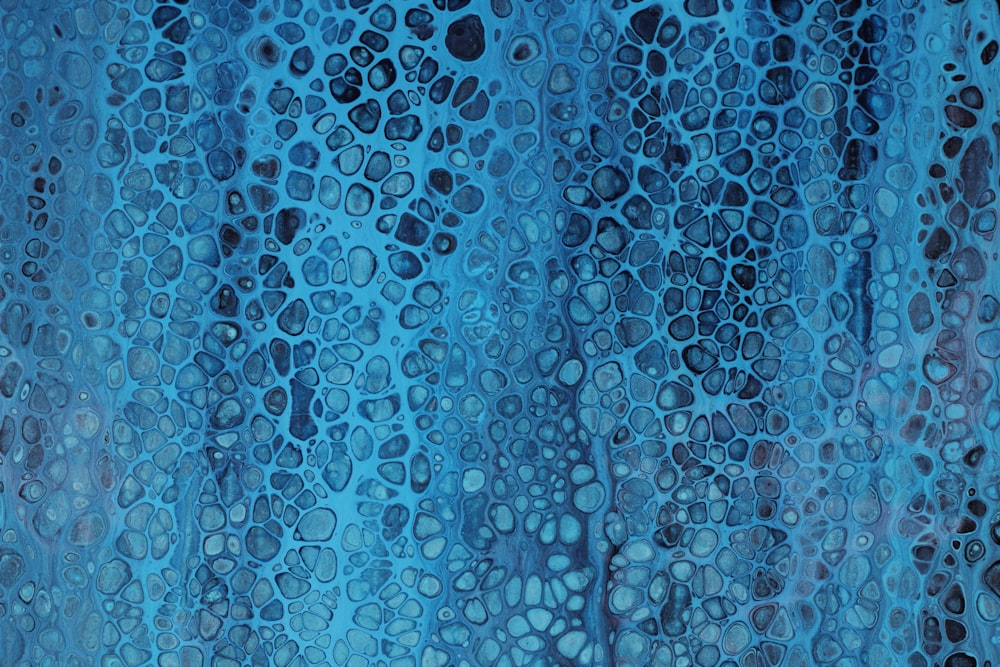 a painting of blue and black circles on a blue background